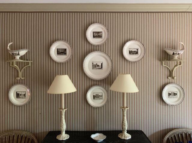 . I come back often to this hall at La Casella, once owned and decorated by the great Thomas Parr . These monochrome plates on the fabric walling with the Colefax wooden shelves are perfection .